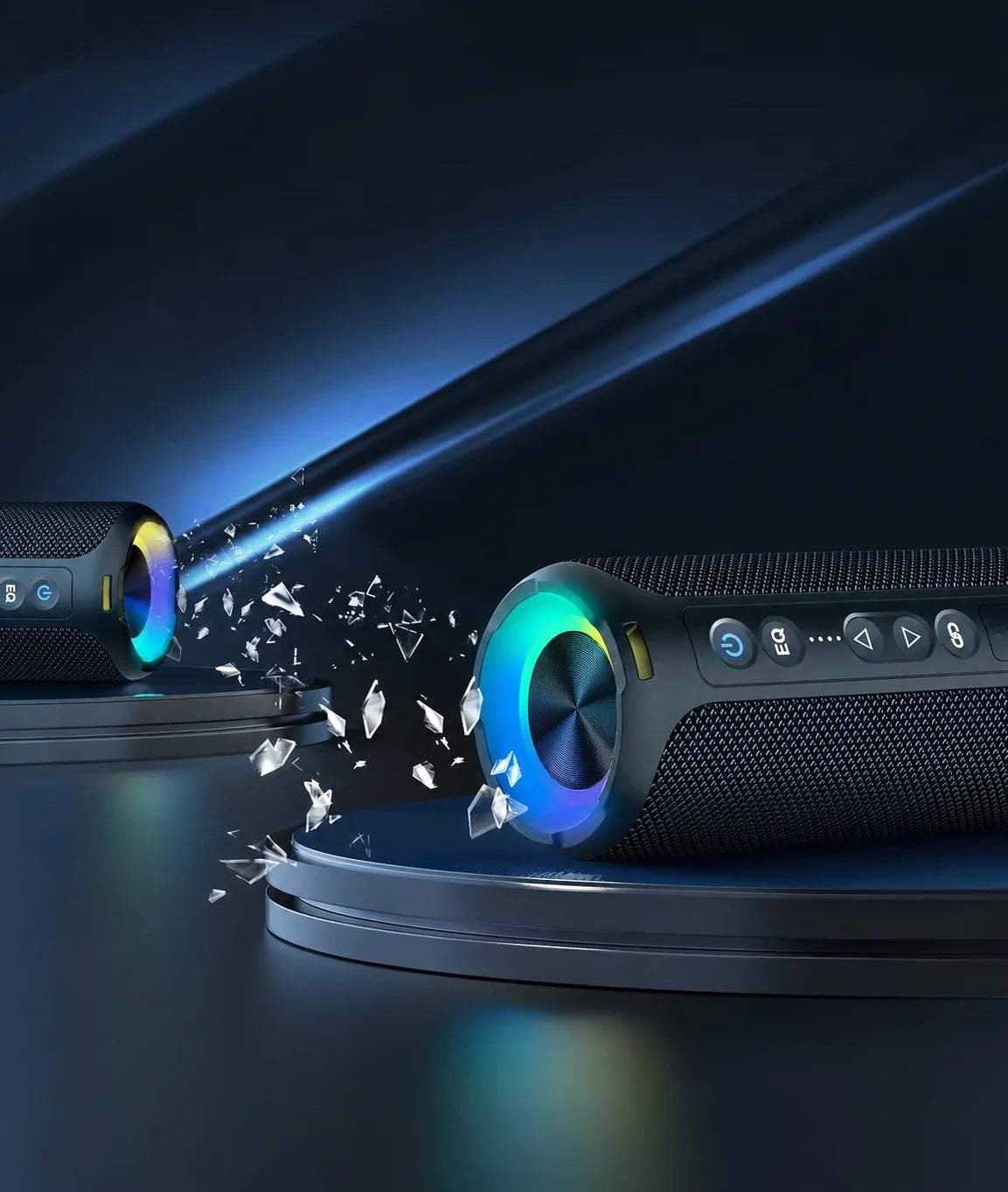 Black portable speaker beside a record player with RGB lighting.