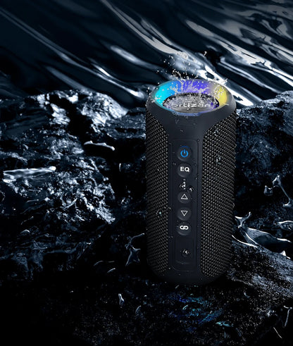 Black portable speaker standing upright in a water-splash setting.